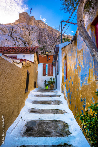 Fototapeta Naklejka Na Ścianę i Meble -  Street of Anafiotika in the old town of Athens, Greece. Anafiotika is district built by workers from the island Anafi. Popular tourist attraction.