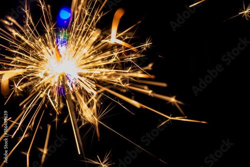 Bengal lights on the background of a Christmas tree. Celebration