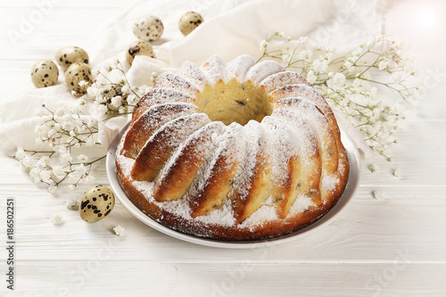 Easter cake, tender flowers, eggs for Easter. The concept of Easter photo