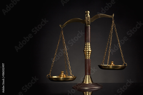 Wooden Judges gavel ,golden scales of justice. Legal office.