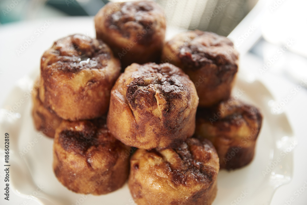 Display Of Freshly Baked Cinnamon Buns In Coffee Shop Display Of Freshly Baked Cinnamon Buns In Coffee Shop