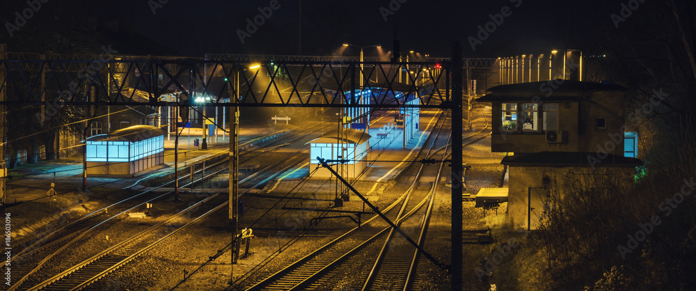 RAYLWAY STATION - A railway track in a small city at night
