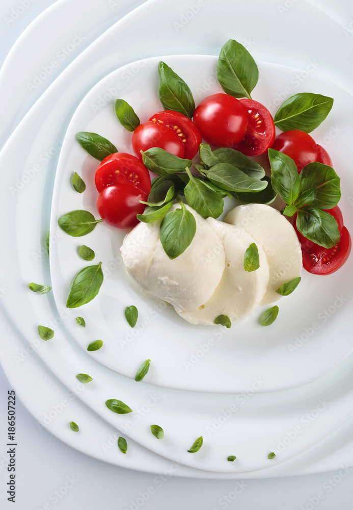 Mozzarella with tomato and basil. Mozzarella with tomato and basil.