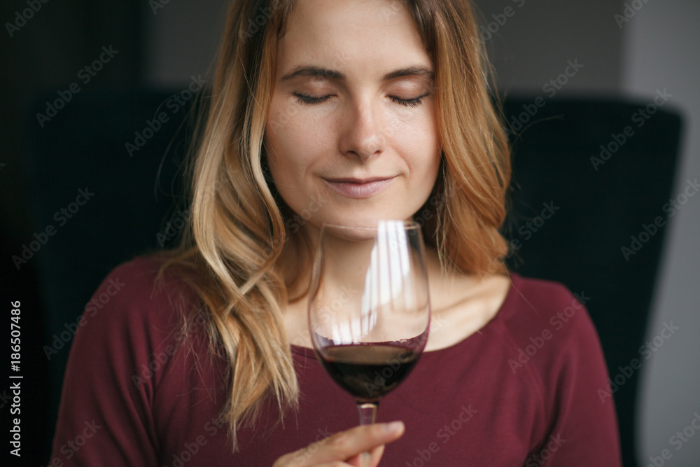 Attractive woman drink red wine in the restaurant Attractive woman drink red wine in the restaurant