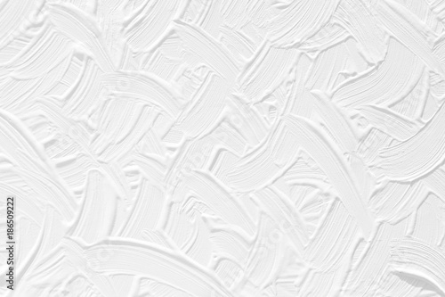 White background. Texture of paint and plaster on the wall with patterns and stripes.