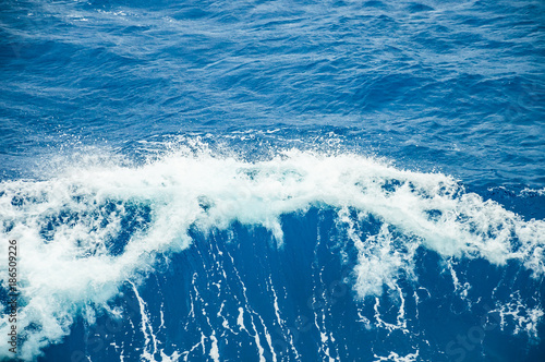 Foaming wave in front of the bow of a ship