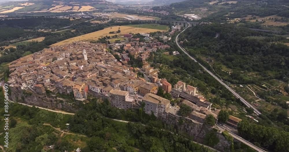 Aerial, ancient aqueduct on Tiber river and antique town perched on the rock Orte in Lazio, Italy, 4K Aerial, ancient aqueduct on Tiber river and antique town perched on the rock Orte in Lazio, Italy, 4K