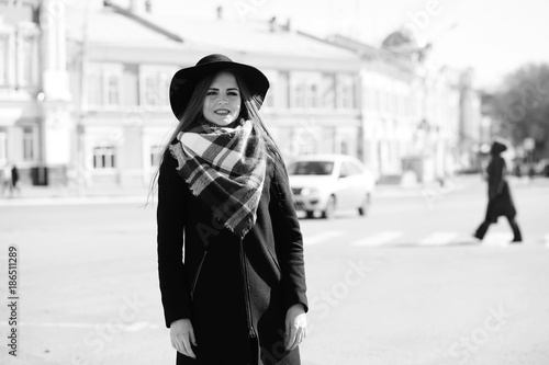 Black and white photo of a young girl on a walk