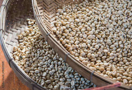 coffee beans on wood basket