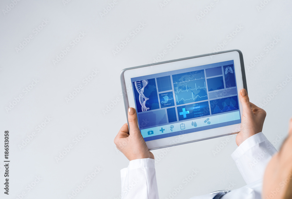 Close of female doctor hands working with tablet pc computer Close of female doctor hands working with tablet pc computer
