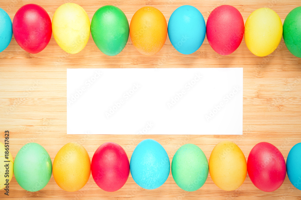 Easter concept painted eggs on wooden table for holiday with place for text pattern with frame Easter concept painted eggs on wooden table for holiday with place for text pattern with frame