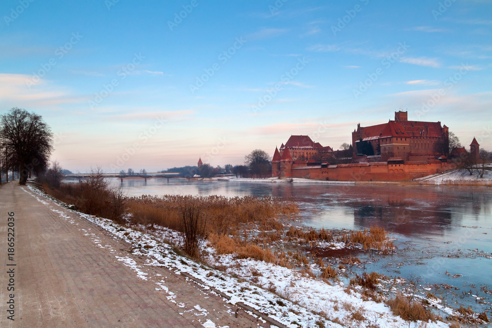 Malbork castle in Poland with reflection in Nogat river