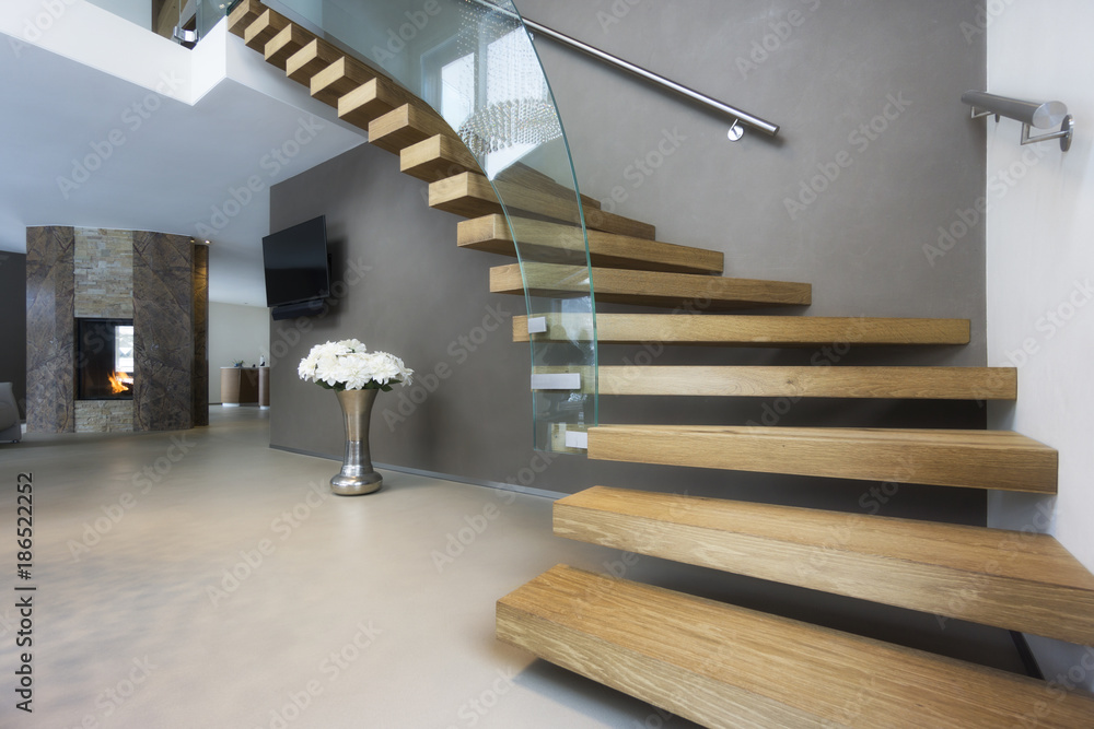 elegant wood and glass staircase in luxury home - obrazy, fototapety, plakaty 
