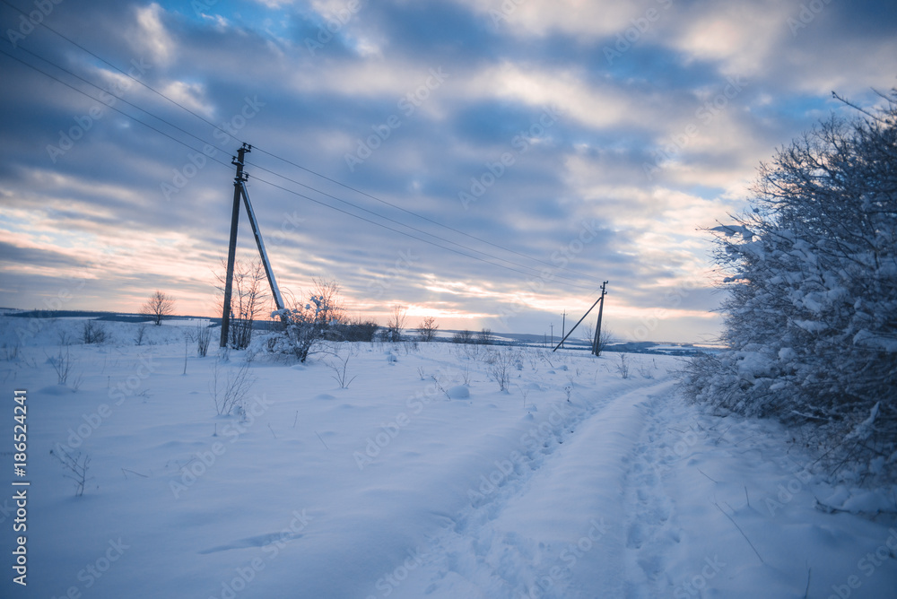 Evening snowy landscape in the countryside outside the city. Evening snowy landscape in the countryside outside the city.