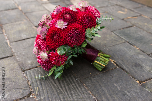 Red bridal bouquet from dahlias. Wedding floristic