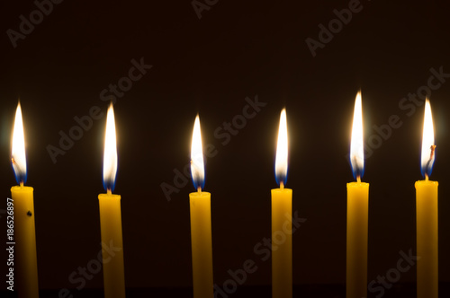 marvelous candle light on dark background to help lead people to the goal