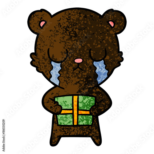 crying cartoon bear with present