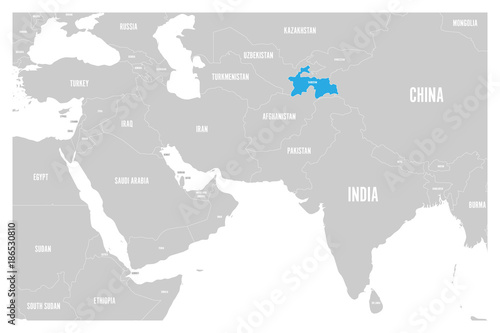 Tajikistan blue marked in political map of South Asia and Middle East. Simple flat vector map..