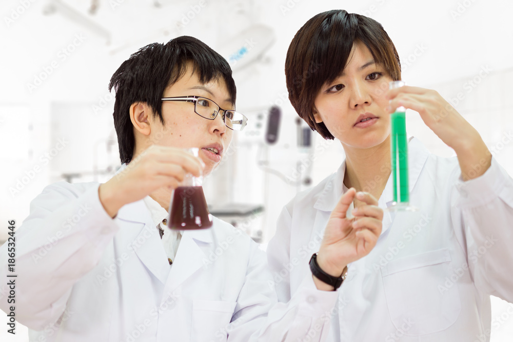 Asian female scientists in lab Asian female scientists in lab