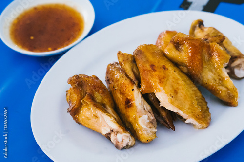 Thai food : Grilled chicken with spicy sauce.