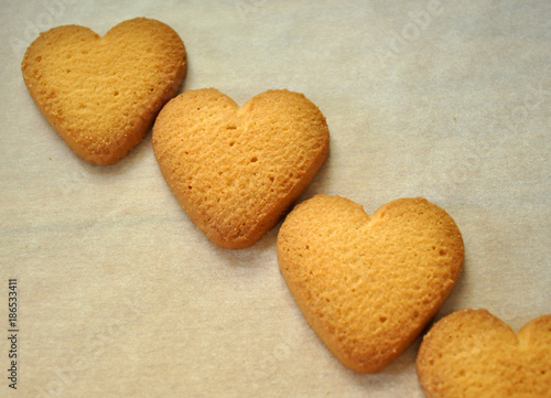 Wallpaper Mural Cookies in form of heart. Baked cookies-hearts on the vintage table. Baking love heart cookies for Valentine day. Gingerbread hearts cookies on white background as Christmas decoration. Love concept. Torontodigital.ca