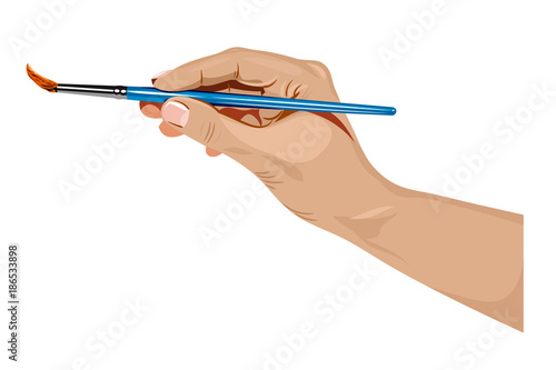 Hand holding a paintbrush for drawing