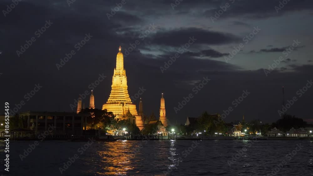 Wat Arun after sunset. Bangkok, Thailand. Panning shot