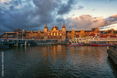 The Central Station of Amsterdam in the light of the setting sun