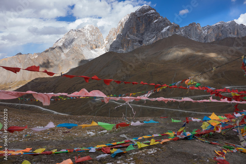 Snow on mountain peak with pray flags in Sichuan ,China