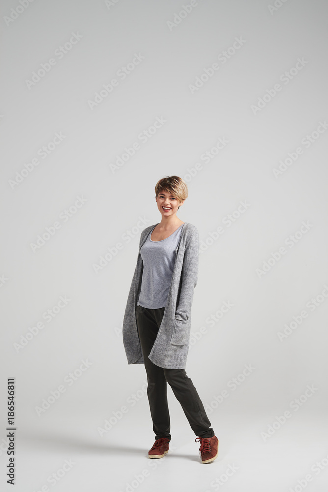Young female with short haircut posing at studio Young female with short haircut posing at studio