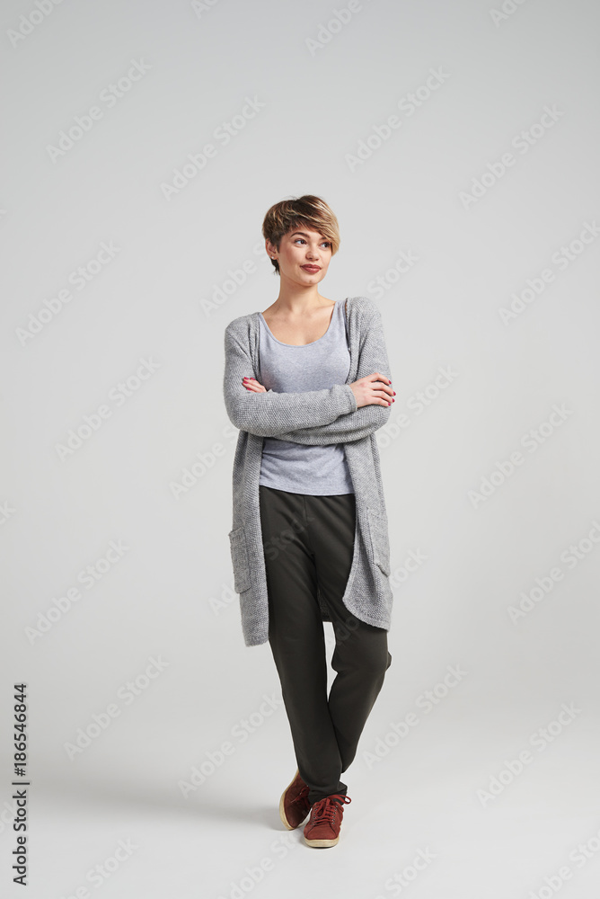 Girl with crossed hands looking aside Girl with crossed hands looking aside