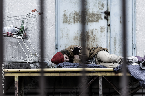 Quadro su tela Sleeping tired homeless man