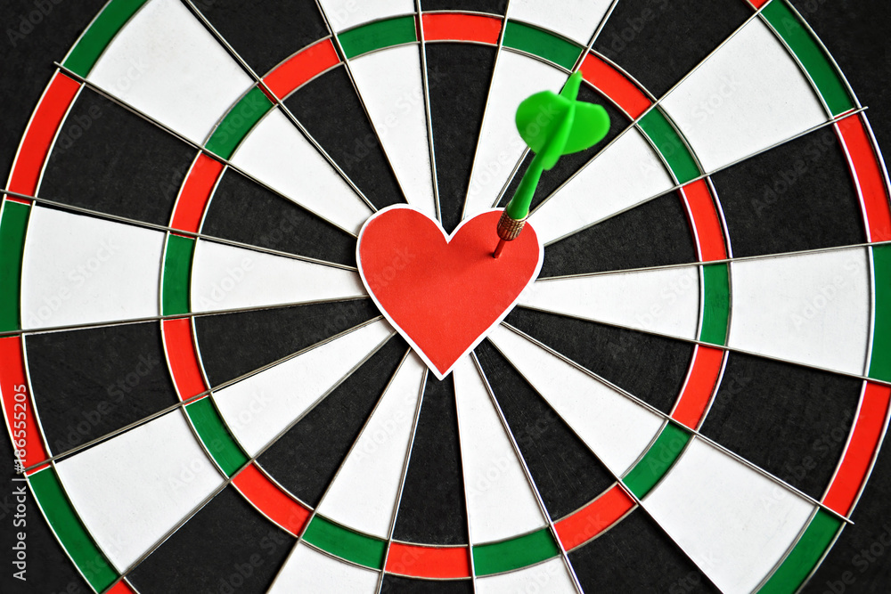 Valentines Day heart and arrow on dart board. Creative love concept. Valentines Day heart and arrow on dart board. Creative love concept.