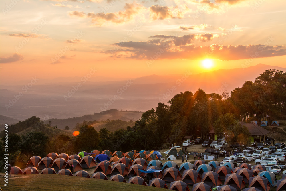 Naklejka premium Nan , Thailand-December 14, 2017 :Camping Tents on Doi Samer Dao Mountain at twilight, Nan Province, Thailand.