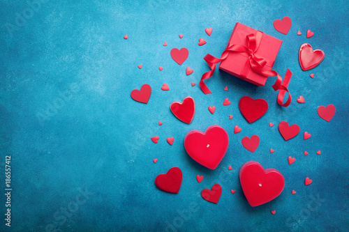 Gift box and red hearts for Valentines day background. Top view. Flat lay.