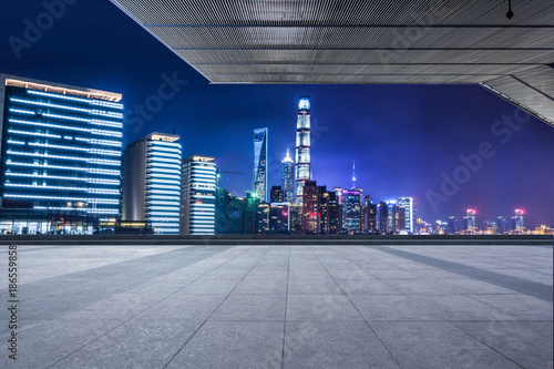 Canvas Print Empty floor with modern skyline and buildings at night in Shanghai