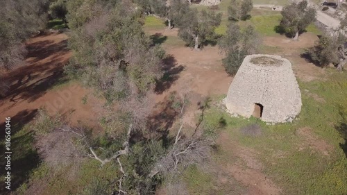 Trullo aerial view. A stone field hut in the shape of a trullo in the Pulia region of Italy photo