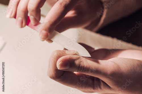 Woman hand with nail file