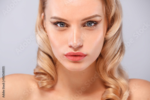 Beauty portrait of female face with natural skin and nude makeup
