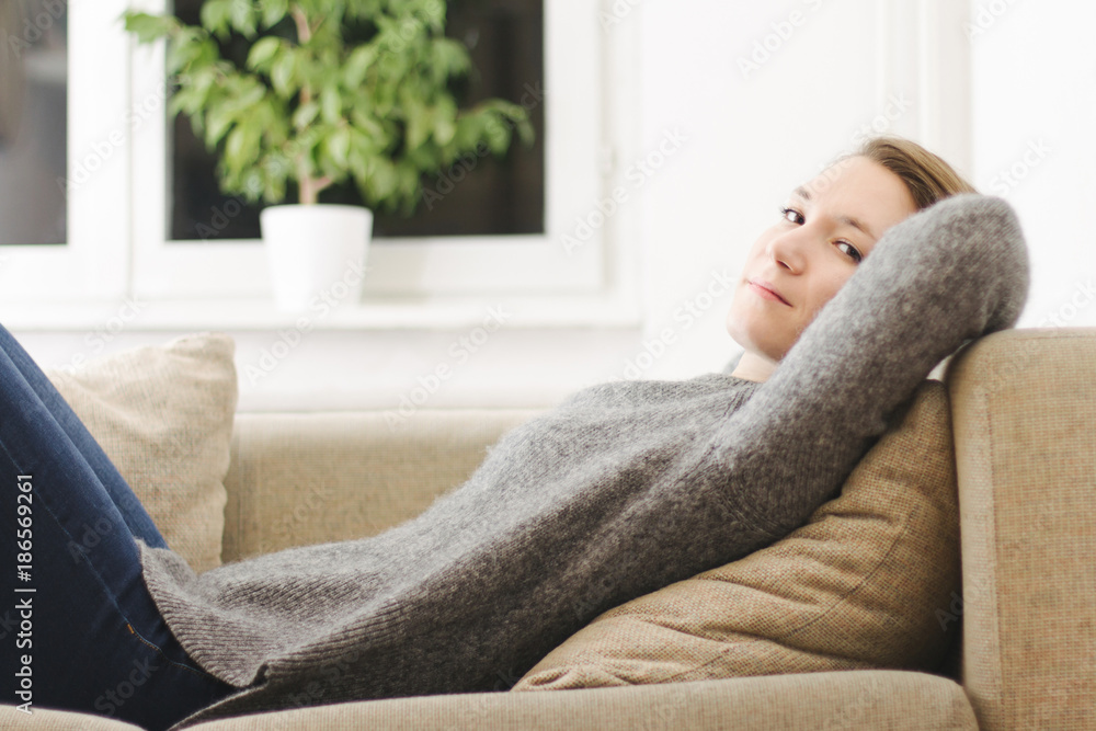Happy lady lying down on bed comfortable pillows daydreaming thinking at home beautiful young caucasian woman Happy lady lying down on bed comfortable pillows daydreaming thinking at home beautiful young caucasian woman