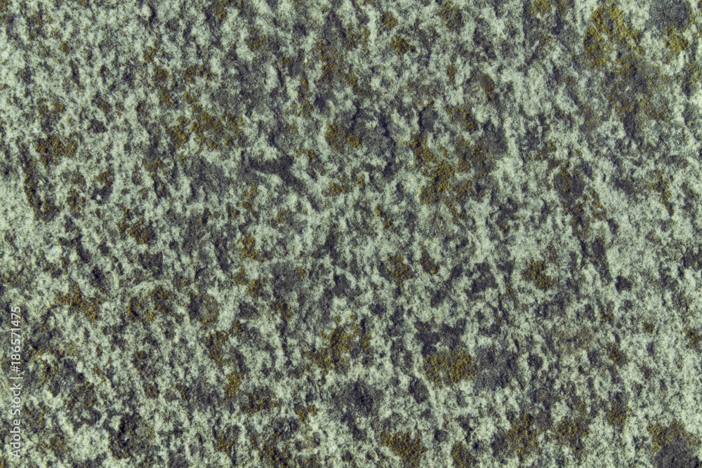 Granite rock closeup background, stone texture, cracked surface Granite rock closeup background, stone texture, cracked surface