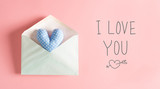 I Love You message with a blue heart cushion in an envelope