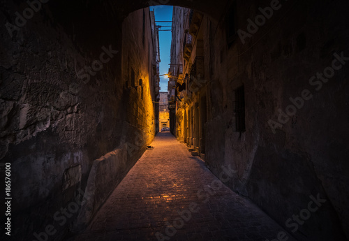 Bright and dark alleys of Valletta. The path to light. Malta.