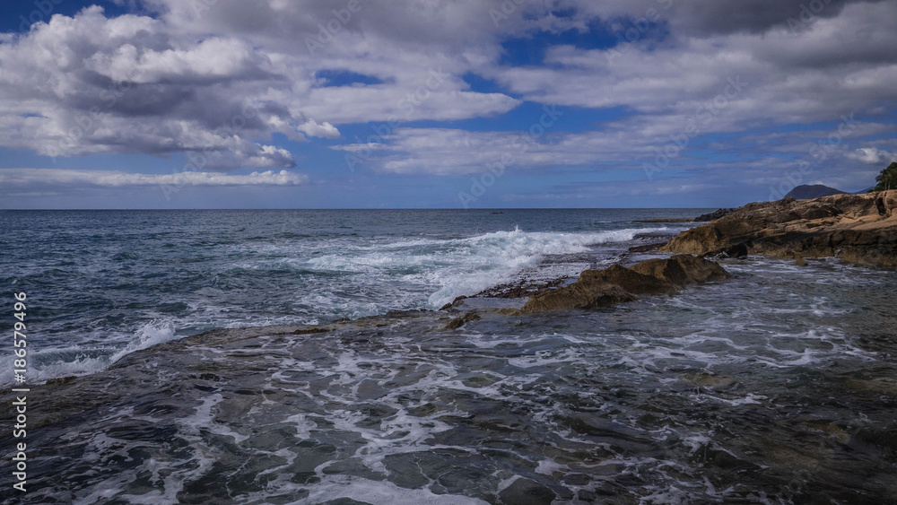 Waves Crashing against rocks on the Hawaiian coastline