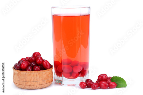dogwood berries in wooden bowl with dogwood juice isolated on white background