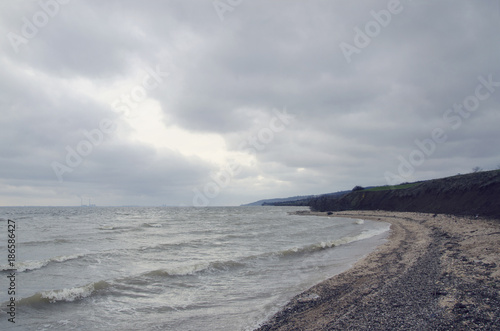 small waves roll on the sandy beach