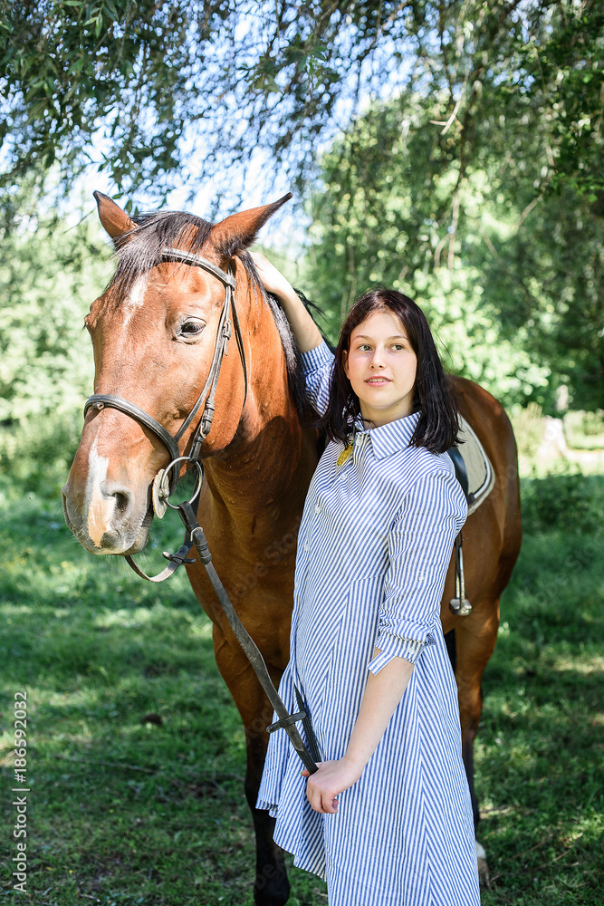 Fototapeta premium Young girl with a horse