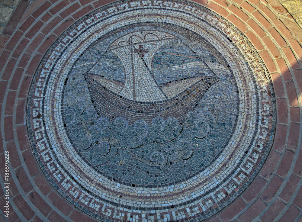 Mosaic of boat and see on floor