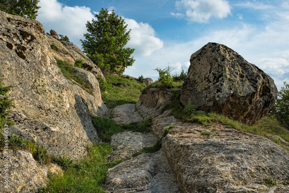 Ancient road with tire tracks left on stones