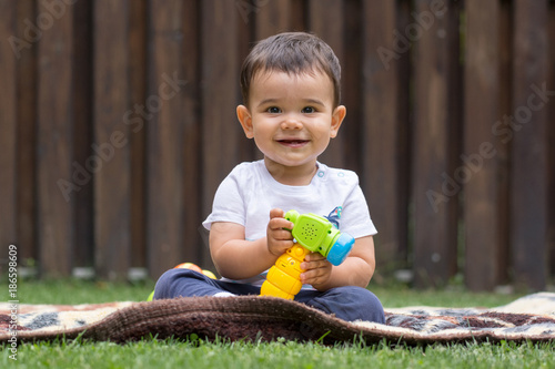 Small child playing on the grass